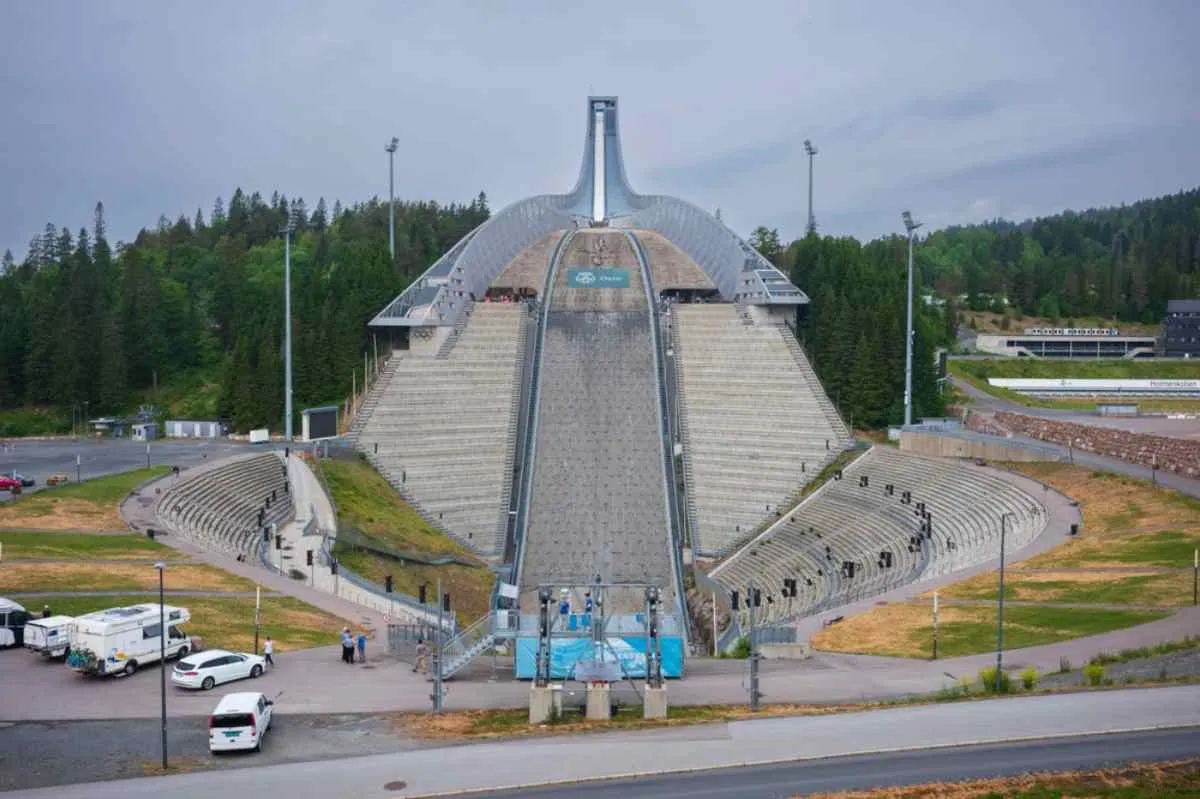 Holmenkollen Ski Jump in Oslo, Norway, seen from the base on a cloudy day.