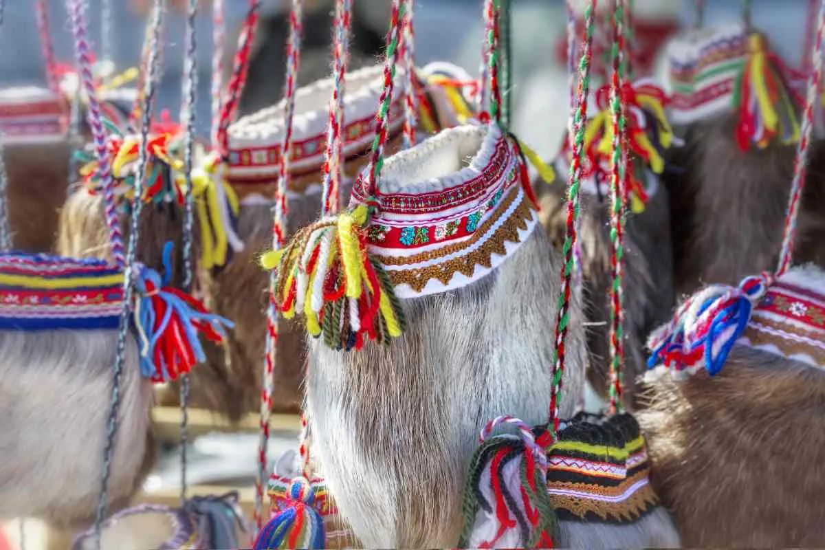 Traditional Sami handicrafts made of reindeer fur and colorful patterns.