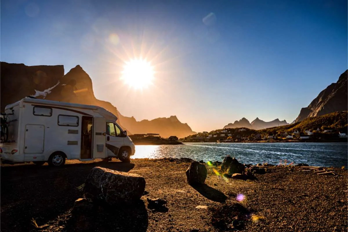 RV parked under the Midnight Sun and by the shore