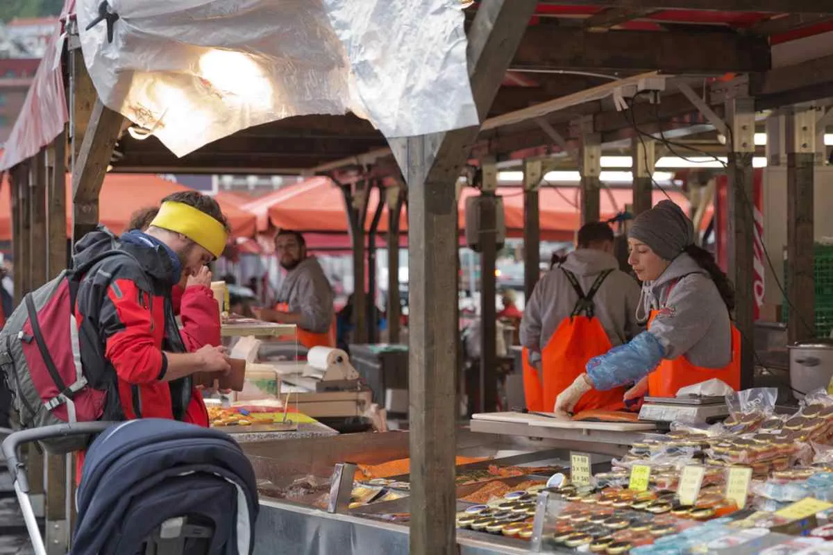 Vendors selling fresh seafood at Bergen Fish Market.