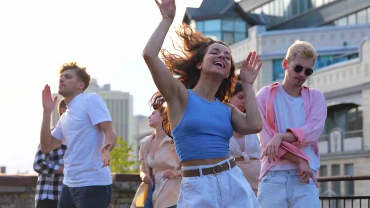 People dancing outdoors during a event in Bergen.