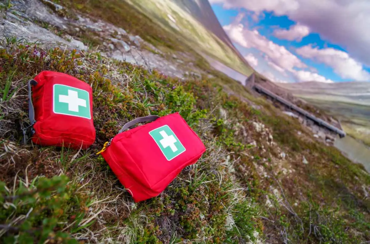 Two first aid kits remain in the grass at a Norwegian site.