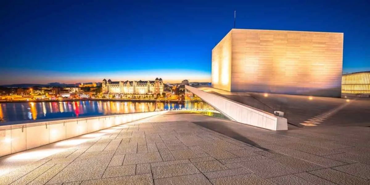 General view of the Oslo Opera House fully illuminated at night in that city.