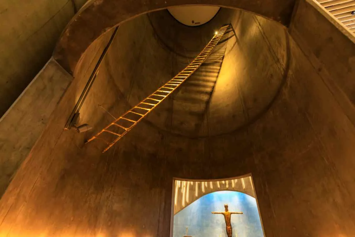 General view of the roof of the Northern Lights Cathedral in Norway with soaring ceilings and austere, modern decor.