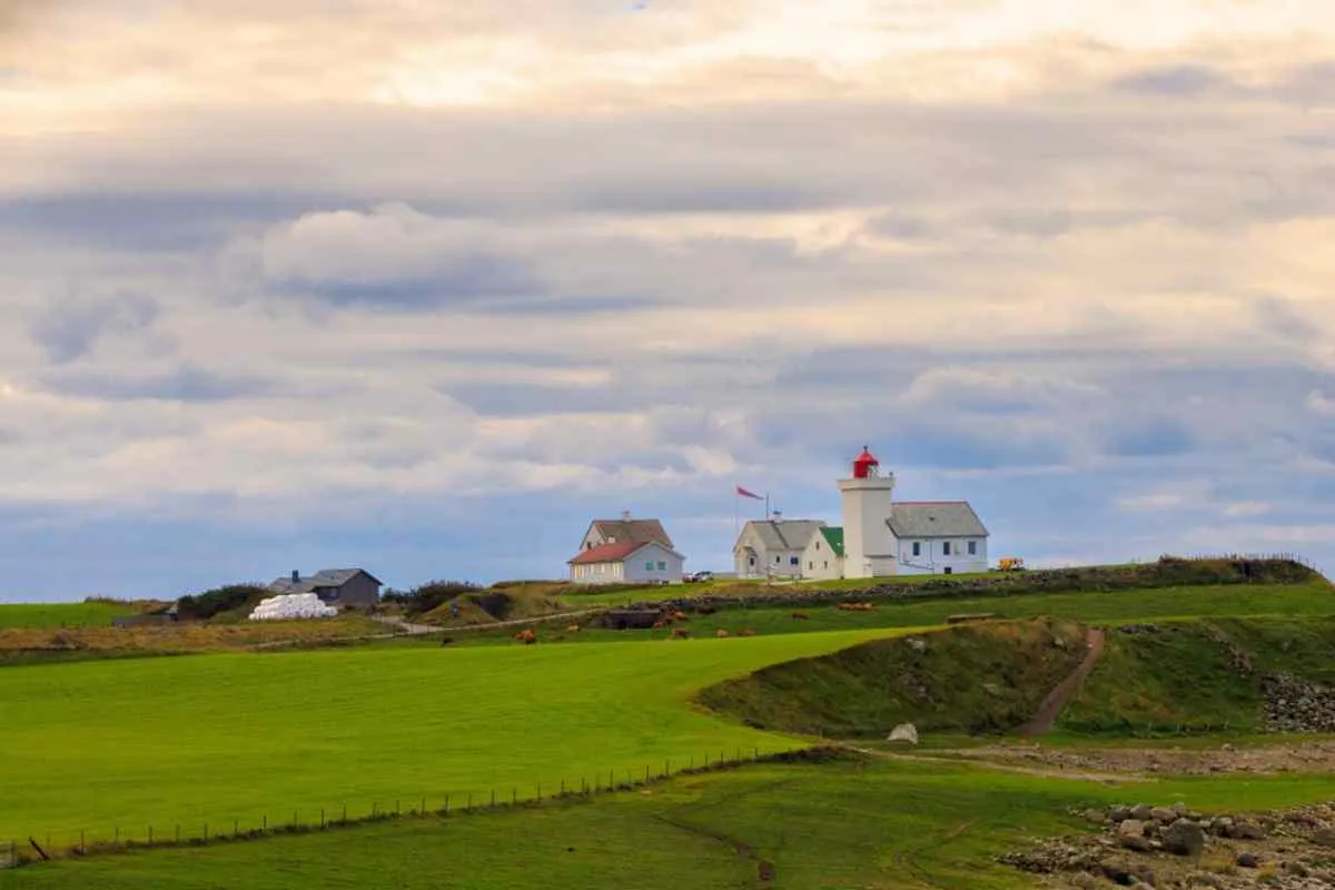 Overview of the lighthouse in Jaeren, Norway, in a green setting.